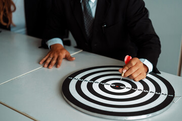 Businessman leader aiming at mission target. Concept of challenge in business marketing bullseye...