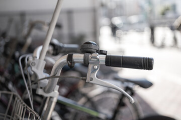 The classic style bike or bicycle vehicle, close-up at the handlebar part. Transportation vehicle object photo, selective focus.