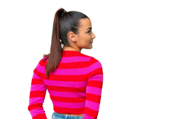 Young beauty woman over isolated chroma key background in back position and looking back