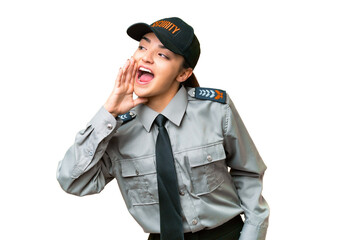 Young safeguard woman over isolated chroma key background shouting with mouth wide open to the...