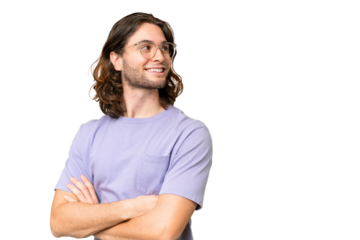 Young handsome man over isolated background looking to the side and smiling