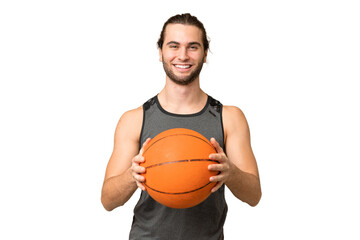 Young handsome man isolated on green chroma background playing basketball