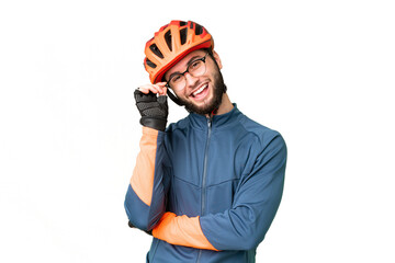 Young cyclist man over isolated chroma key background with glasses and happy