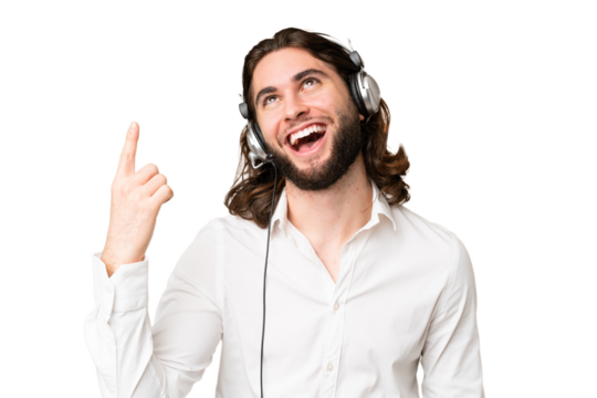 Telemarketer man working with a headset over isolated chroma key background pointing up and surprised