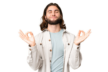 Young handsome man over isolated chroma key background in zen pose