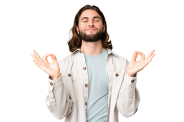 Young handsome man over isolated chroma key background in zen pose