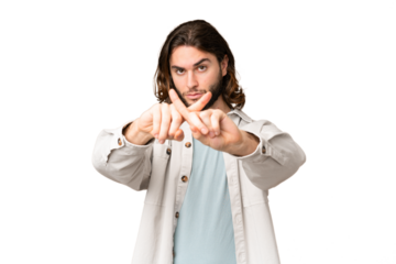 Young handsome man over isolated chroma key background making stop gesture with her hand to stop an act