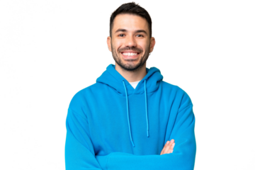 Young handsome caucasian man over isolated chroma key background keeping the arms crossed in frontal position