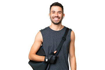 Young sport caucasian man with sport bag over over isolated chroma key background laughing