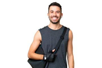 Young sport caucasian man with sport bag over over isolated chroma key background laughing