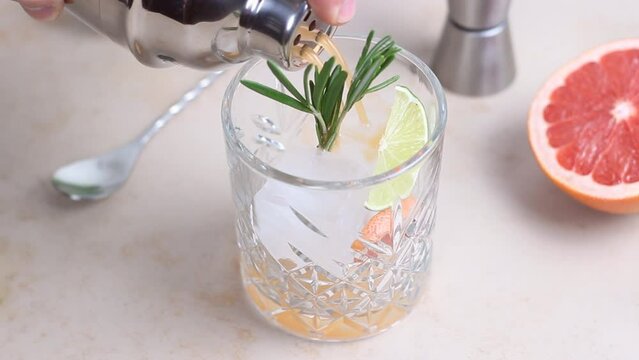 Paloma cocktail with grapefruit, lime and rosemary. Grapefruit juice. Alcohol. Tequila.