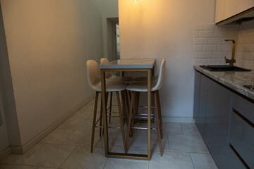 The table and chairs are in the kitchen