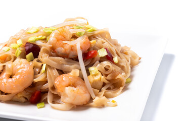 Pad Thai with shrimp and vegetables isolated on white background. traditional thai food