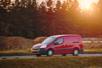 A fast and reliable delivery service with a commercial van on the road. Delivery truck on the...