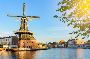 Traditional windmill and Haarlem canals, Netherlands - obrazy, fototapety, plakaty