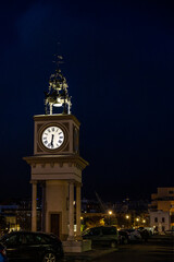Tarragona harbor clock at night