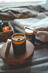 Burning candle in home interior, aesthetics