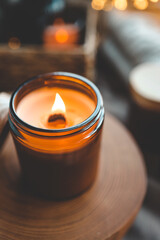 Burning candle in a festive cozy interior
