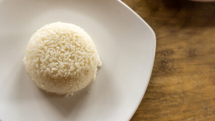 Fototapeta na wymiar healthy food concept. Top view of white rice on white plate. copy space. cooked rice
