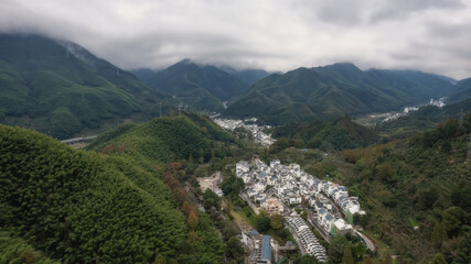 Fototapeta na wymiar Aerial shot of Mount Huangshan forest winding mountain road in Anhui
