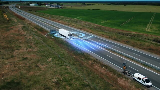 Futuristic truck with a trailer, controlled by artificial intelligence, driving down highway. Self-driving autonomous driverless transportation, freight transportation of the future without a driver. 