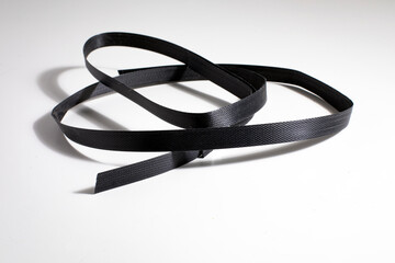 Nylon cord strap for industrial use isolated on white background, close up plastic poly strap for...