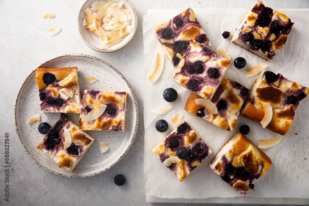 Sticker blueberry cheesecake bars with coconut