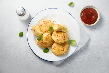 Homemade cheese scones with tomato sauce