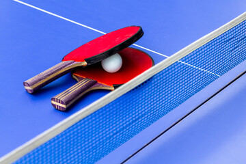 travel to Georgia - ping pong rackets and ball on blue table for playing table tennis on seaside...