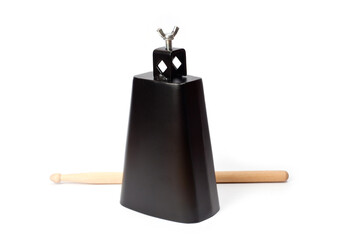 Cowbell percussion musical instrument, black metal with a wooden stick.