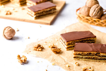 Gerbeaud Cake. Zserbo. Traditional Hungarian multi-layer cake with plum jam, nuts and covered with chocolate glaze