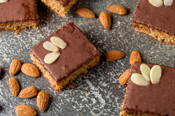 Chocolate almond dough. Traditional chocolate dough decorated with almond flakes