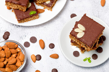 Chocolate almond dough. Traditional chocolate dough decorated with almond flakes