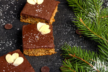 Chocolate almond dough. Traditional Christmas chocolate dough decorated with almond flakes