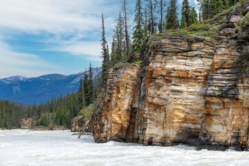 View over the Athabasca River flowing from the nearby Athabasca Falls, Jasper National Park, AB,...