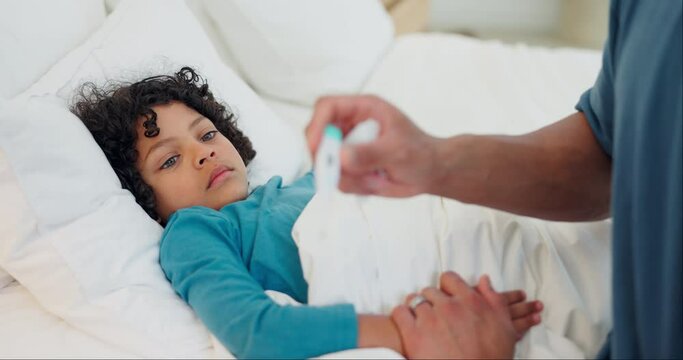 Father, thermometer and sick child in bed for fever, infection or illness in care, support or love at home. Closeup of dad monitoring ill kid, son or little boy in bedroom with virus, cold or flu