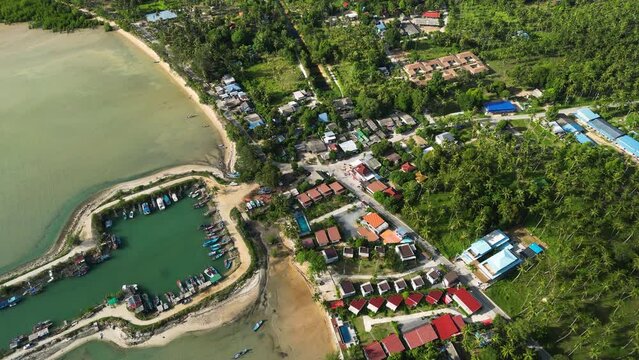 Wok Tum Canel for boats in shallow bay water, aerial orbit view