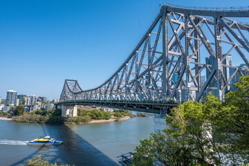 Ferry going under Story Bridge in Brisbane, Australia.