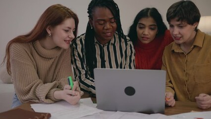 Four diverse friends young women looking at laptop screen, doing research, typing messages, discussing. Student collaboration brainstorming. Smart female girls studying working at home campus - Powered by Adobe