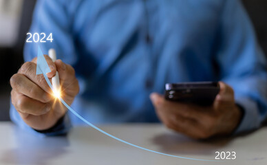 Human with 2024 new year business financial investment data, business growth, action plan for success growth, market trend on 2024, business plan and development, new business start up development