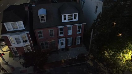 City row house at night. Aerial view of American inner city urban housing during dusk.