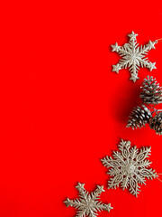 Beautiful Christmas decorations, shiny toys on a bright red background. Christmas poster design. New Year Poster