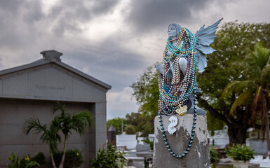 Statue with beads in cemetery
