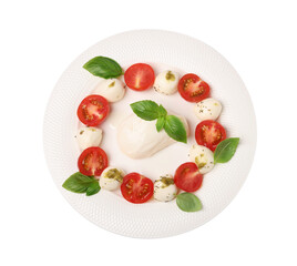 Plate of tasty Caprese salad with mozzarella, tomatoes, basil and pesto sauce isolated on white, top view