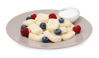 Plate of tasty lazy dumplings with berries and sour cream isolated on white