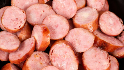 sliced sausages in plate, close up