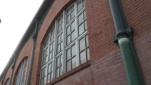Architectural building window of a industrial storage facility in Paris.