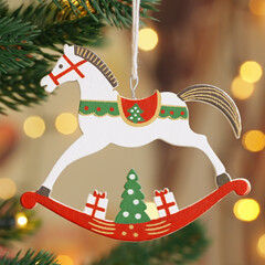Christmas concept Christmas tree  decoration wooden toy horse rotate on branch tree on background...