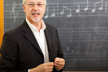 Experienced music teacher in classroom