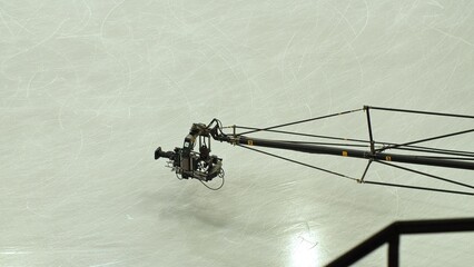 The camcorder on the crane works in the ice arena.